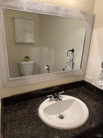 a bathroom with a sink and mirror