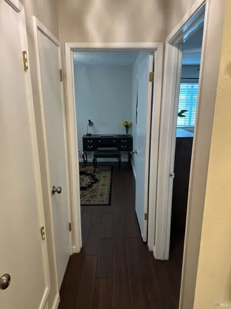 a view of a bathroom from a hallway