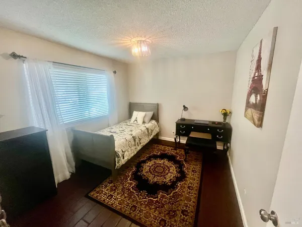 a bed room with a bed and a couch