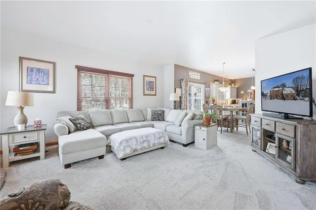 a bathroom with a granite countertop sink and a large mirror