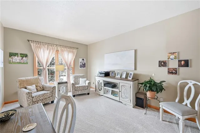 a view of a workspace with furniture and wooden floor