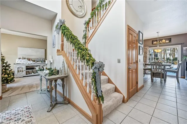 a view of entryway and hall with dining room