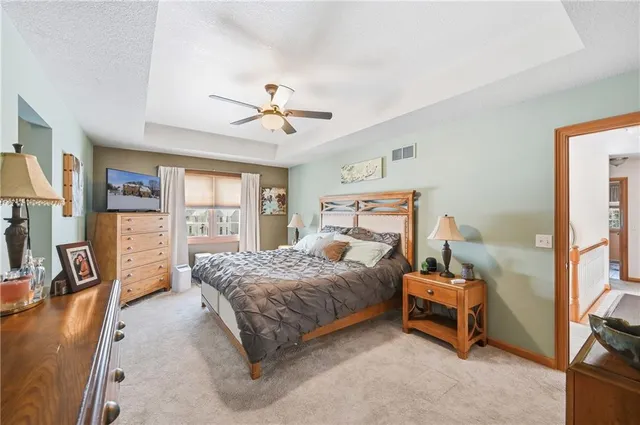 a living room with furniture a couch and bookshelf