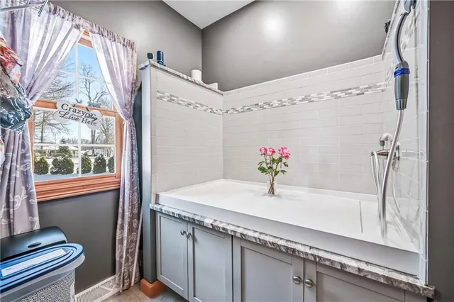 a dining room with furniture and window