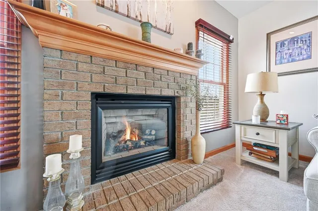 a view of a hallway with wooden floor and a window