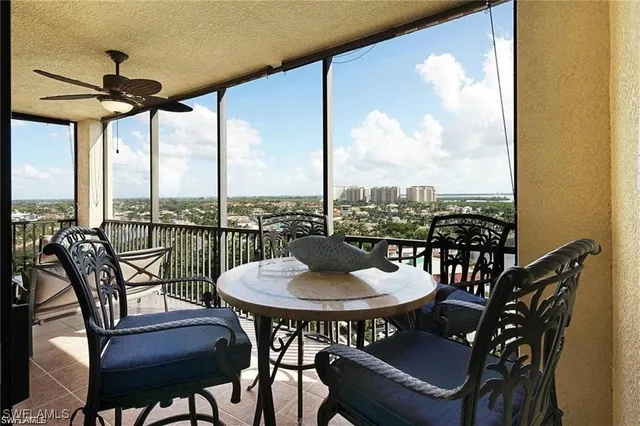 a dining room with furniture window and outdoor view