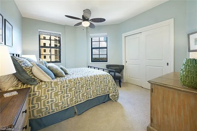 a spacious bedroom with a bed and a window