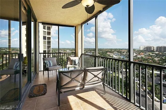 a view of a balcony with chairs