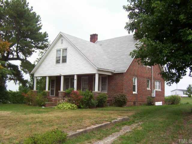 4596 Virgilina Road Roxboro, NC 27574 - Photo 1 of 1 a front view of a house with a yard
