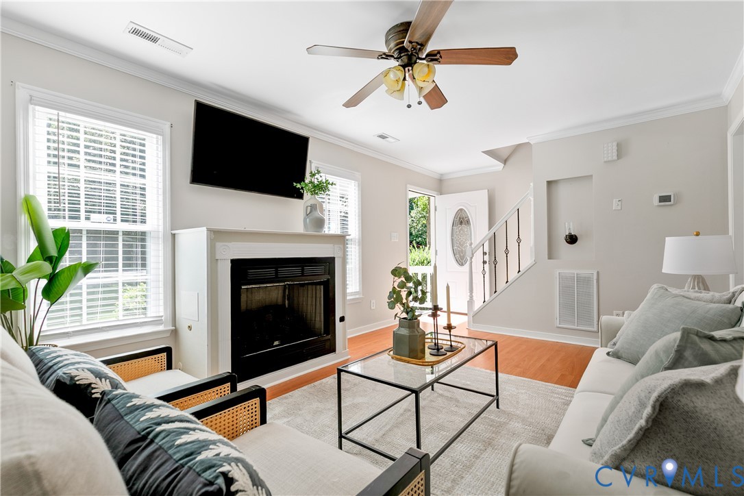 Living space featuring wood-finish flooring, a fir