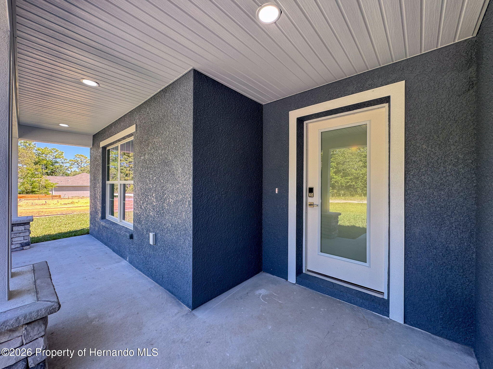 8988 Waterbird Way Weeki Wachee, FL 34613 - Photo 5 of 42 an empty room with windows