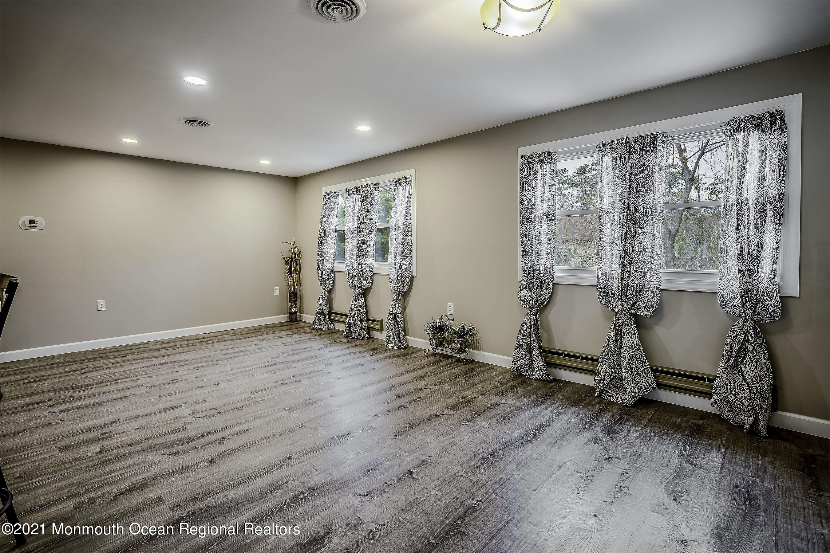 17 Berry Hill Road Whiting, NJ 08759 - Photo 11 of 26 a view of a room with wooden floor and windows