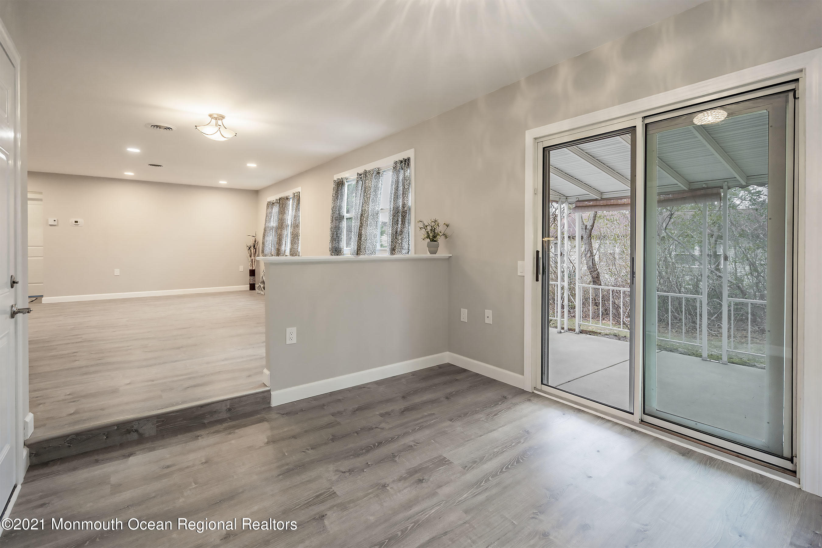 17 Berry Hill Road Whiting, NJ 08759 - Photo 13 of 26 an empty room with wooden floor and windows