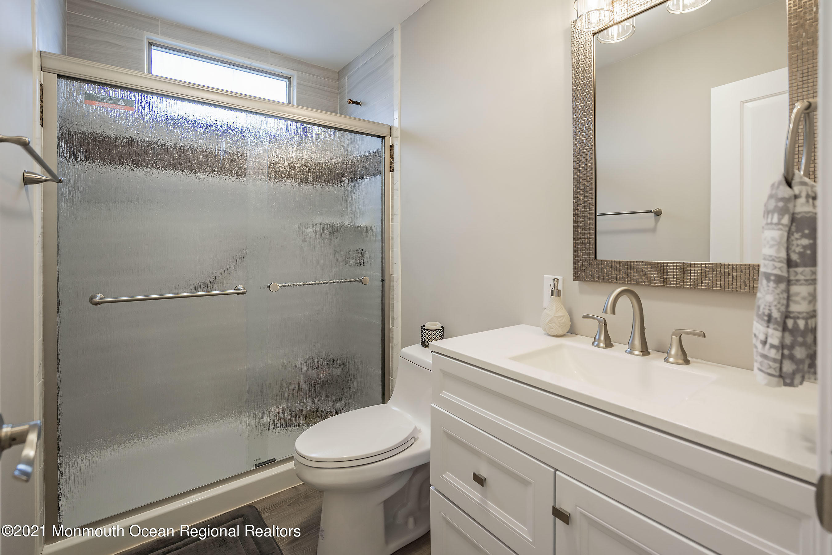 17 Berry Hill Road Whiting, NJ 08759 - Photo 14 of 26 a bathroom with a sink a toilet and shower