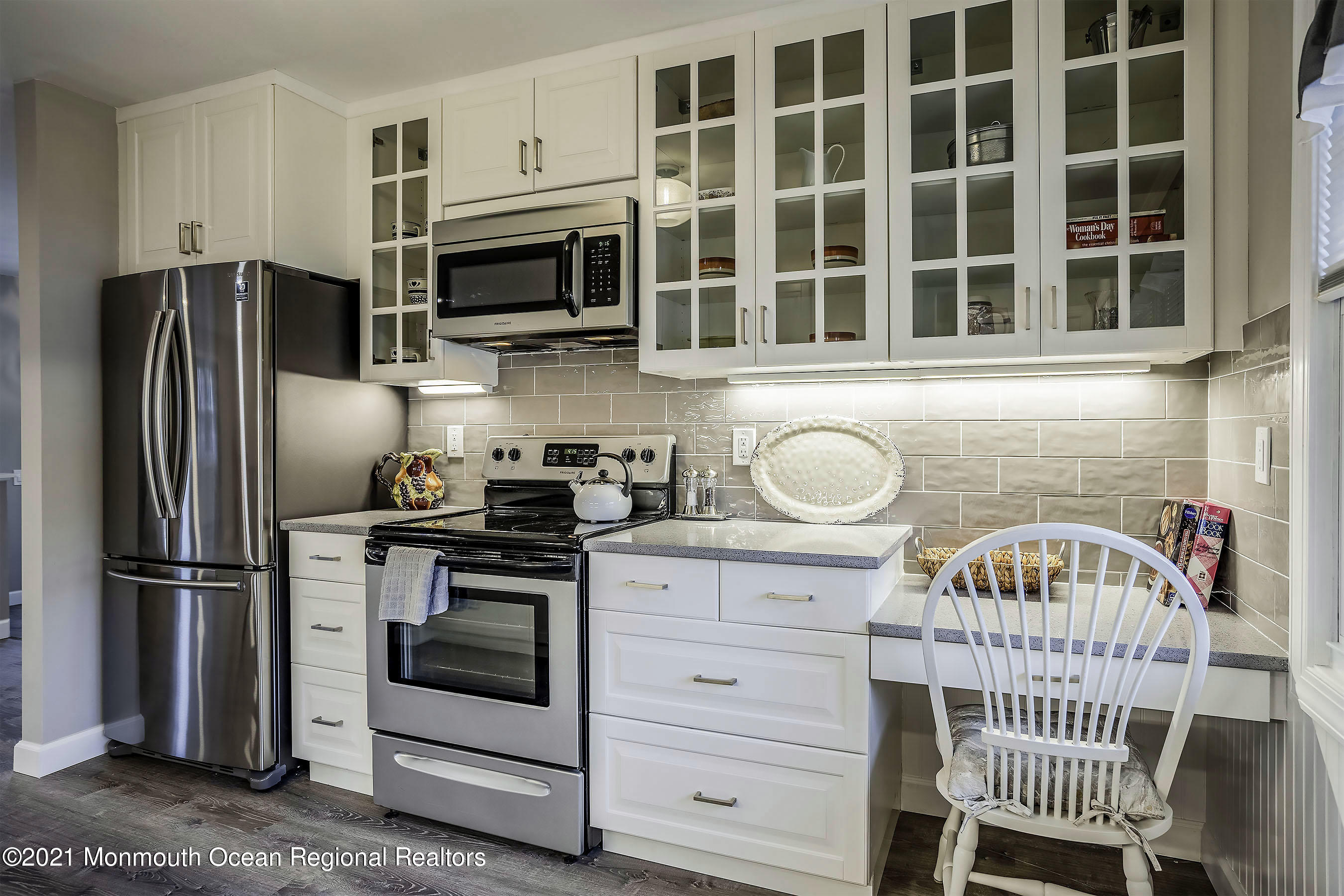 17 Berry Hill Road Whiting, NJ 08759 - Photo 5 of 26 a kitchen with stainless steel appliances a stove a sink and a refrigerator