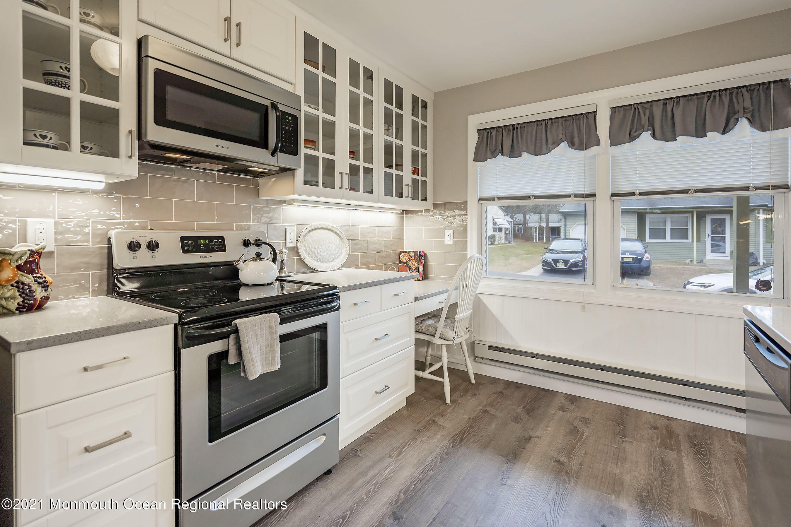 17 Berry Hill Road Whiting, NJ 08759 - Photo 6 of 26 a kitchen with stainless steel appliances a stove microwave and cabinets