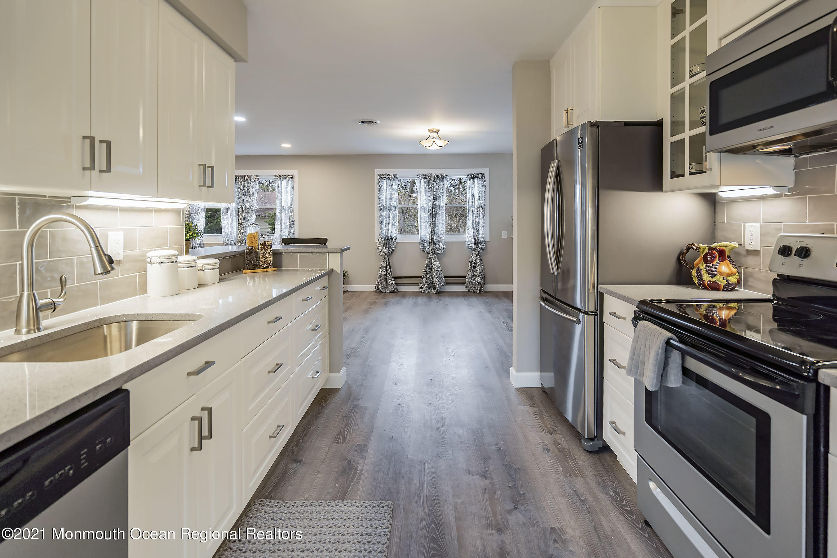 17 Berry Hill Road Whiting, NJ 08759 - Photo 8 of 26 a kitchen with stainless steel appliances a sink dishwasher a refrigerator and a stove top oven