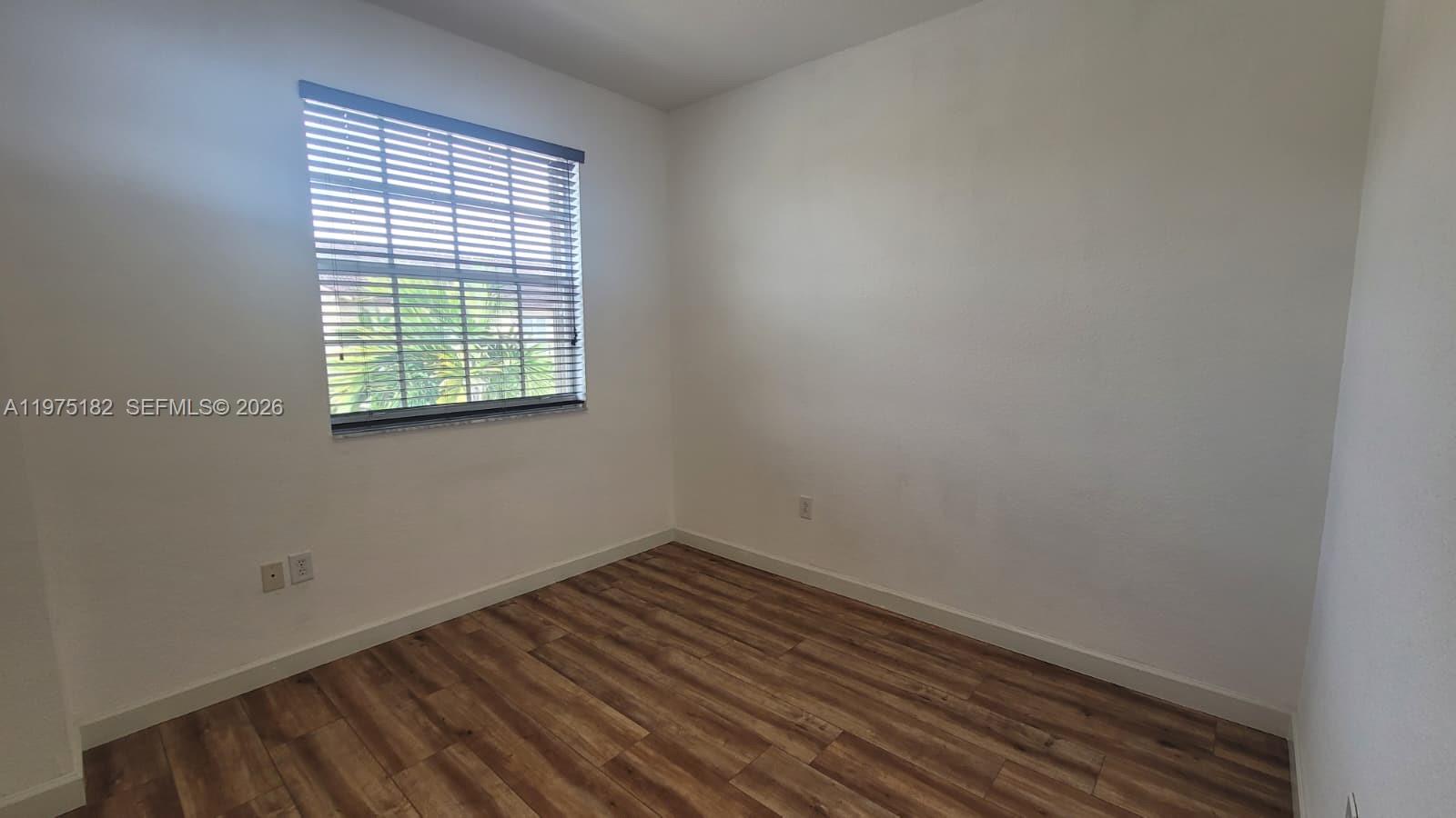 12842 Southwest 134th Street Miami, FL 33186 - Photo 12 of 22 an empty room with a window