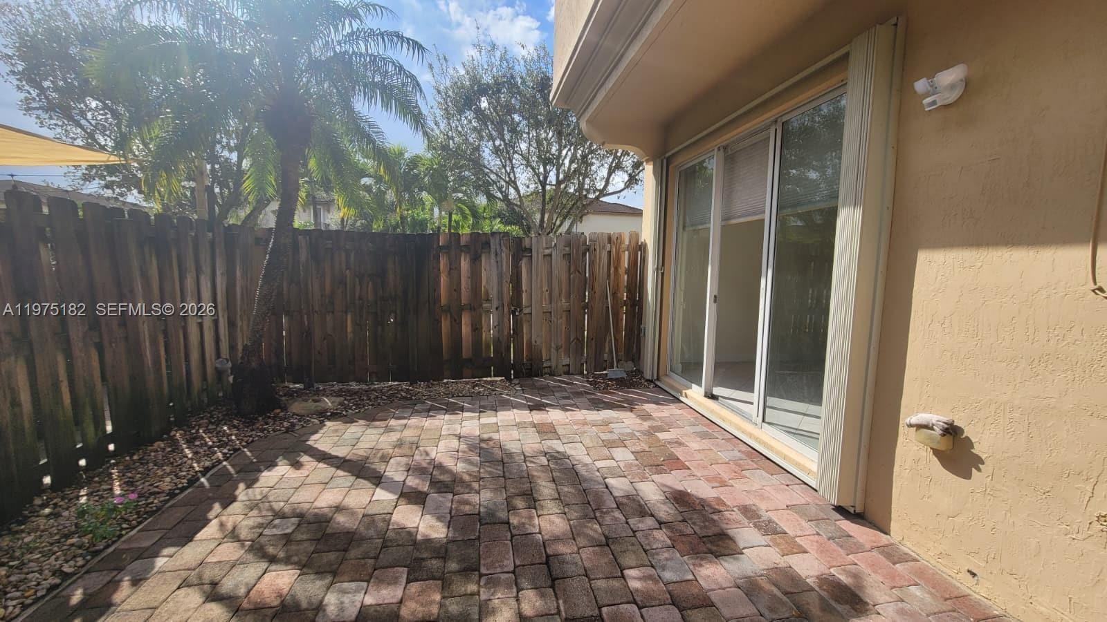 12842 Southwest 134th Street Miami, FL 33186 - Photo 17 of 22 a view of small space with wooden fence