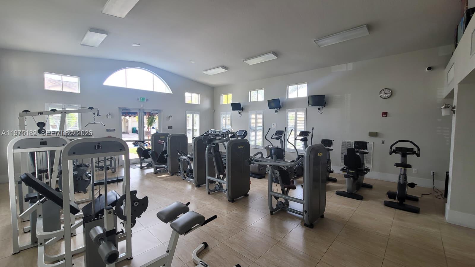 12842 Southwest 134th Street Miami, FL 33186 - Photo 18 of 22 a view of a room with gym equipment