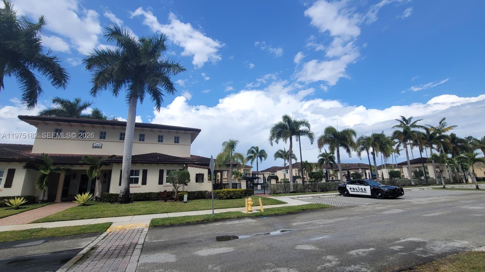 12842 Southwest 134th Street Miami, FL 33186 - Photo 20 of 22 a view of street with parked cars