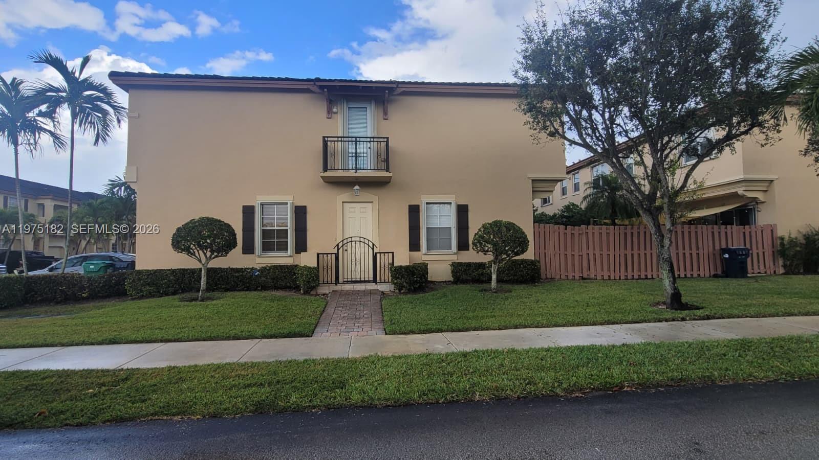 12842 Southwest 134th Street Miami, FL 33186 - Photo 2 of 22 a front view of a house with garden