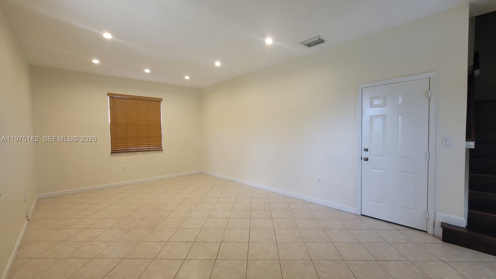 12842 Southwest 134th Street Miami, FL 33186 - Photo 9 of 22 a view of an empty room