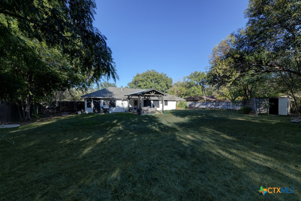 1229 Rapids Road New Braunfels, TX 78130 - Photo 25 of 27 a view of a house with a big yard