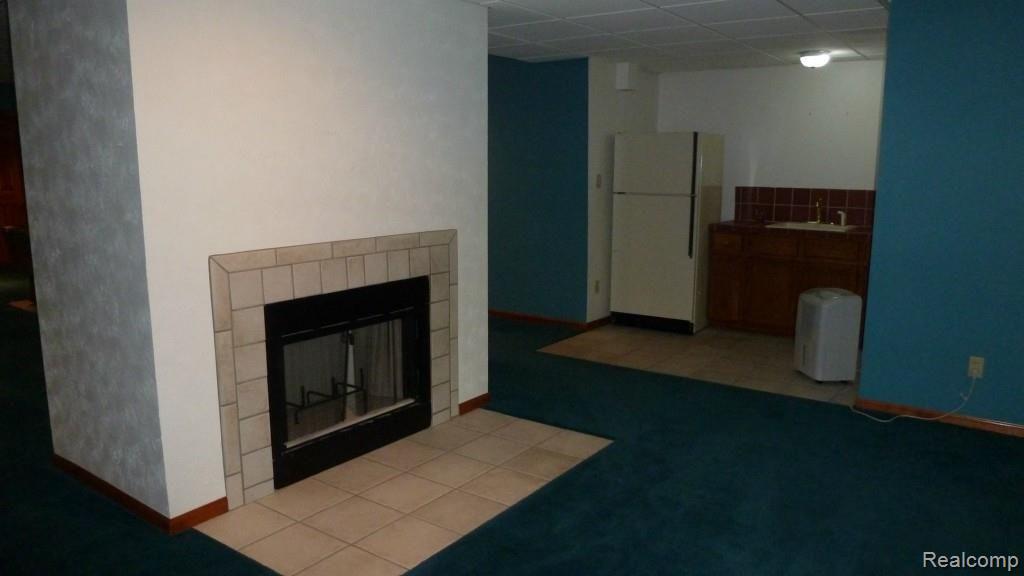 1196 Timber Ridge Court Milford, MI 48380 - Photo 25 of 30 Bsmt Family Rm Natural Fireplace