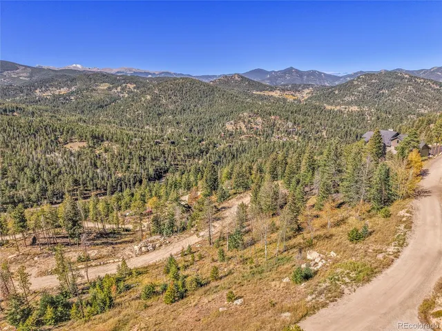 a view of a city with mountains in the background