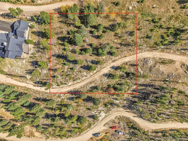 a view of a large mountain with mountains in the background