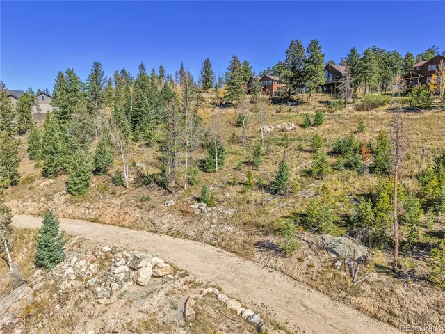 a view of a yard with trees