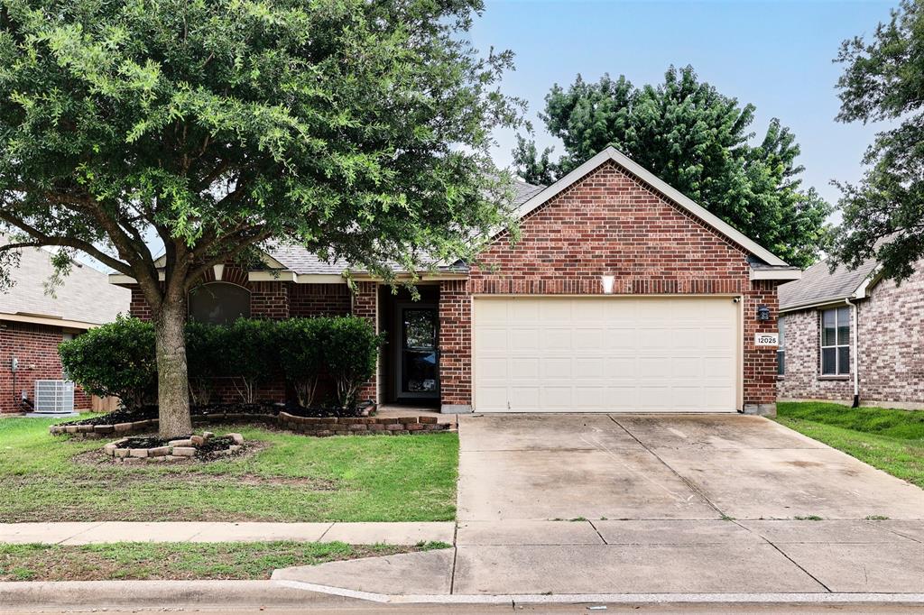 12025 Rowsley Lane Burleson, TX 76028 - Photo 1 of 1 View of front facade with an attached garage, driveway, a front lawn, and brick siding