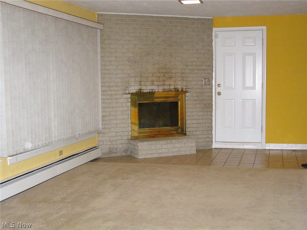 4309 Brainard Road Chagrin Falls, OH 44022 - Photo 6 of 28 The family room has a wood burning FP.