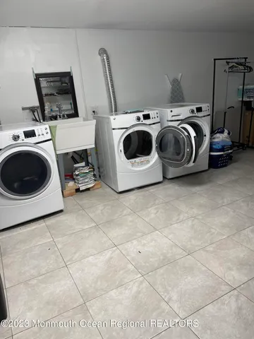 a utility room with dryer and washer