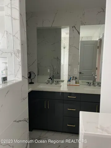 a bathroom with a sink a vanity and a mirror