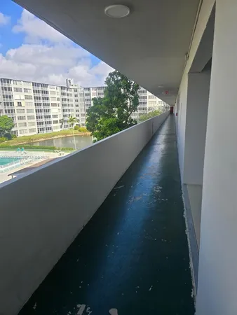 a view of swimming pool from a balcony