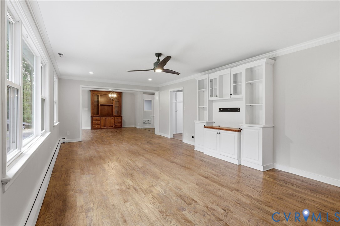 10152 Georgetown Road Mechanicsville, VA 23116 - Photo 7 of 35 a view of empty room with wooden floor and windows