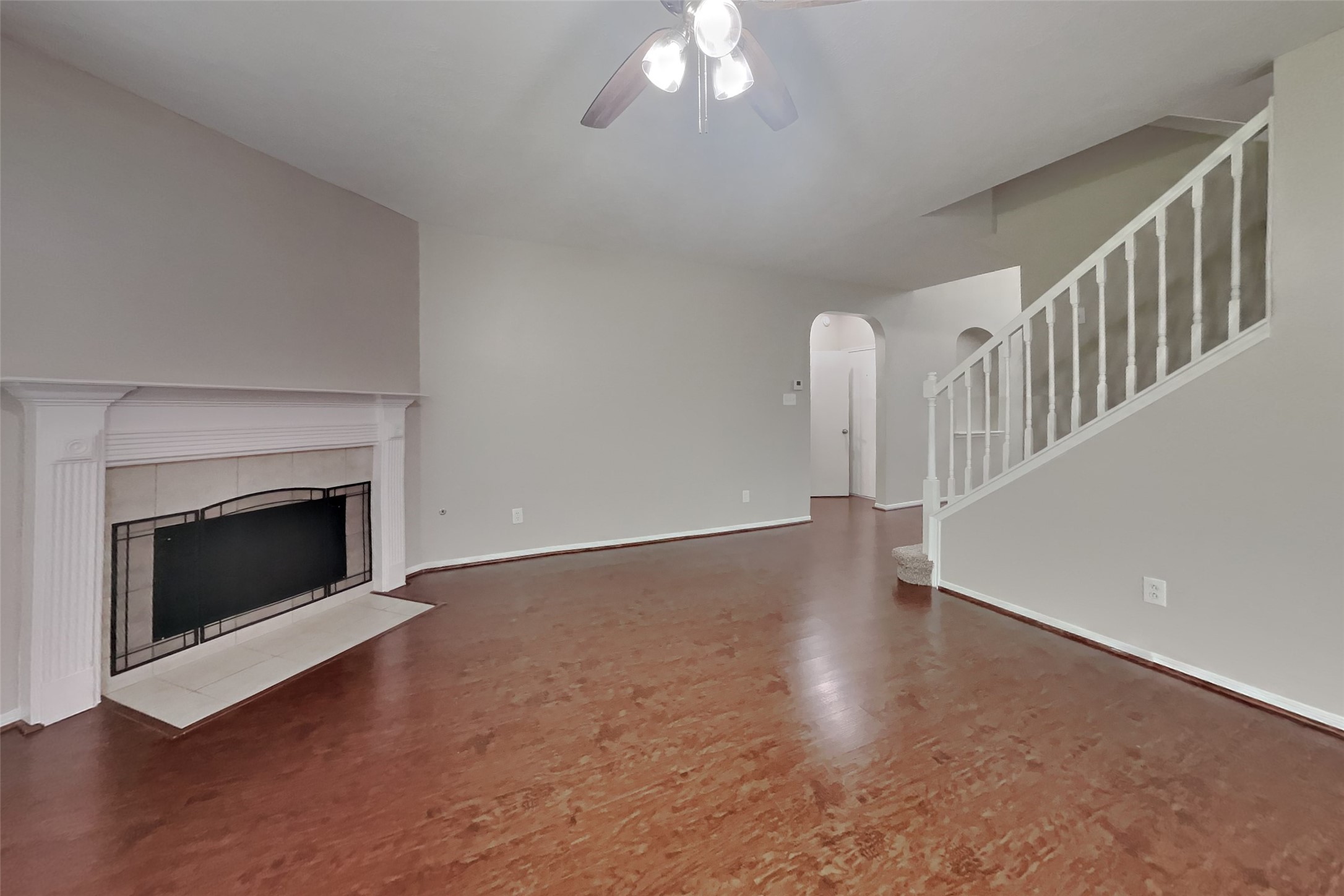 619 Bending Bough Drive Spring, TX 77388 - Photo 2 of 22 a view of an empty room with wooden floor and fireplace