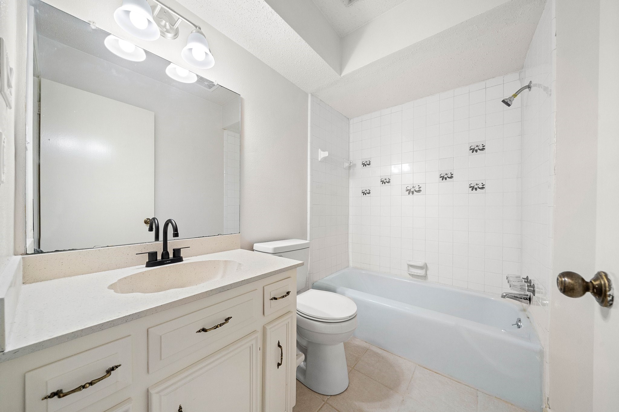 17116 Beaver Springs Drive, Unit 7 Houston, TX 77090 - Photo 11 of 14 a bathroom with a sink a toilet and shower