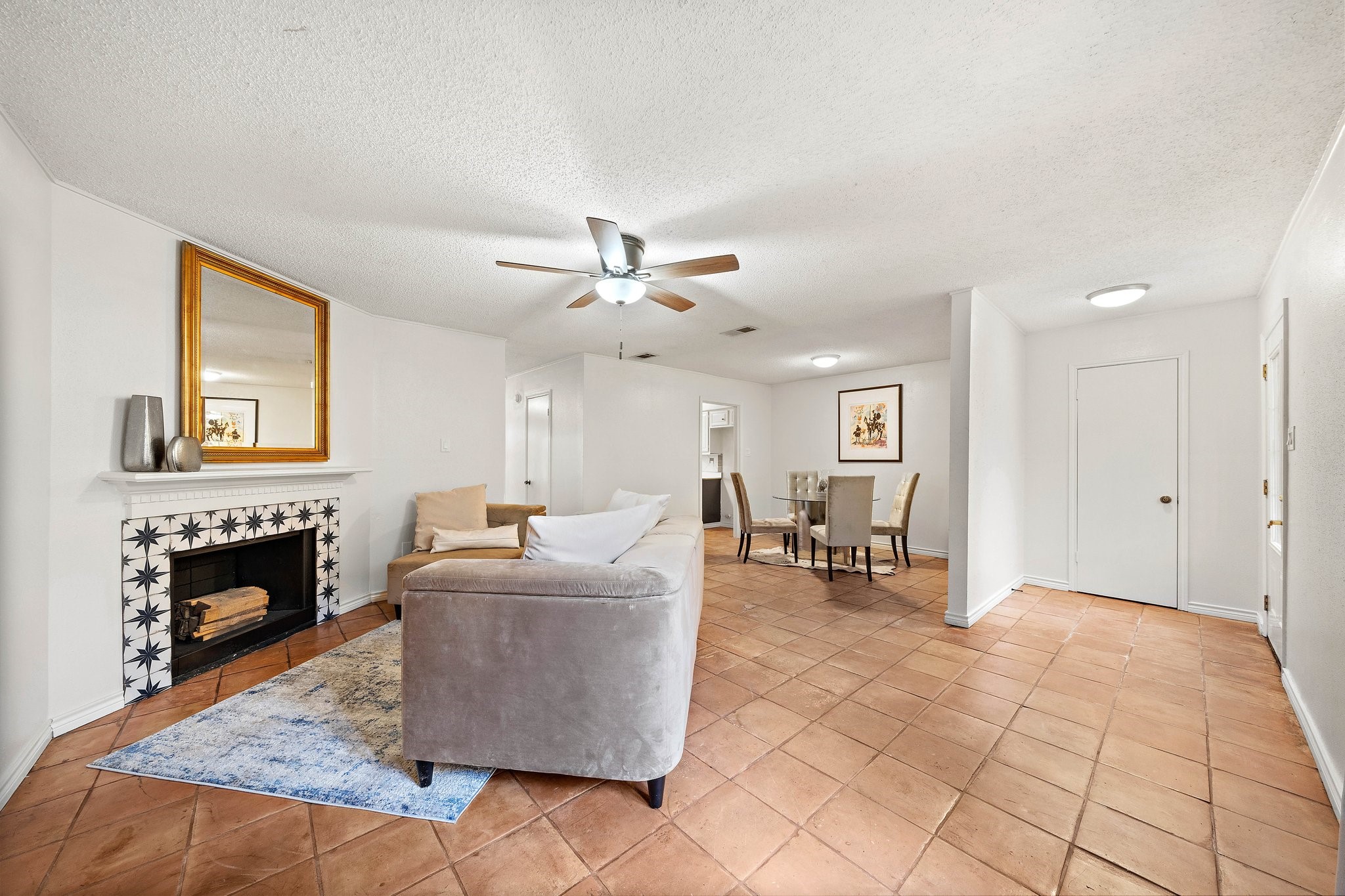 17116 Beaver Springs Drive, Unit 7 Houston, TX 77090 - Photo 5 of 14 a living room with furniture and a dining table with fireplace