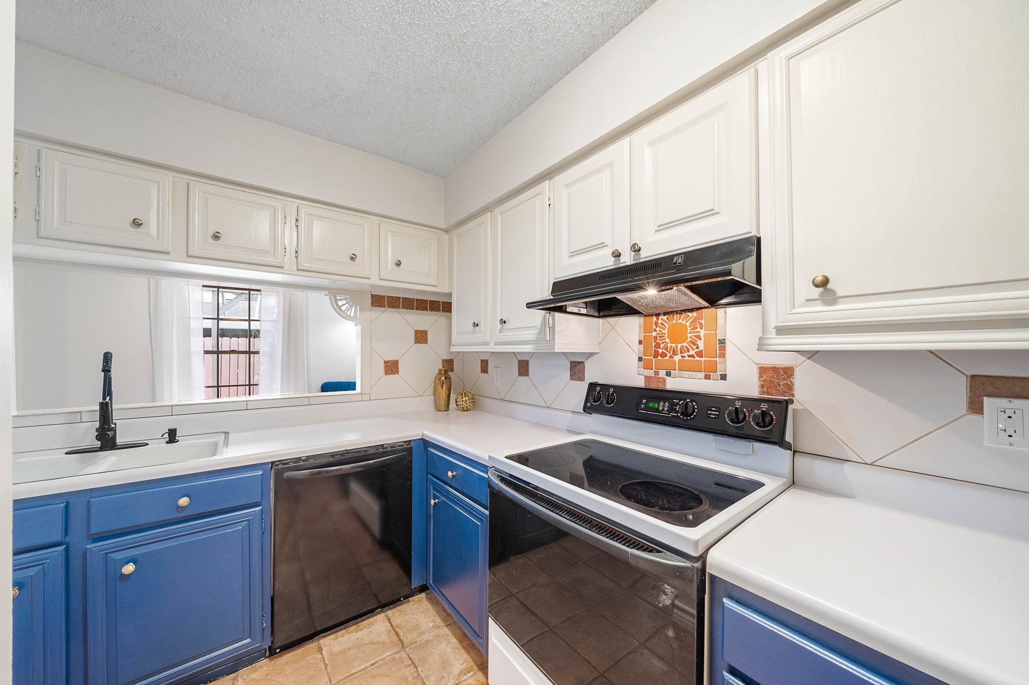 17116 Beaver Springs Drive, Unit 7 Houston, TX 77090 - Photo 6 of 14 a kitchen with a sink a stove and cabinets