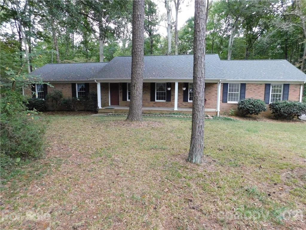 2136 Sunset Road Charlotte, NC 28216 - Photo 2 of 34 a front view of a house with a yard