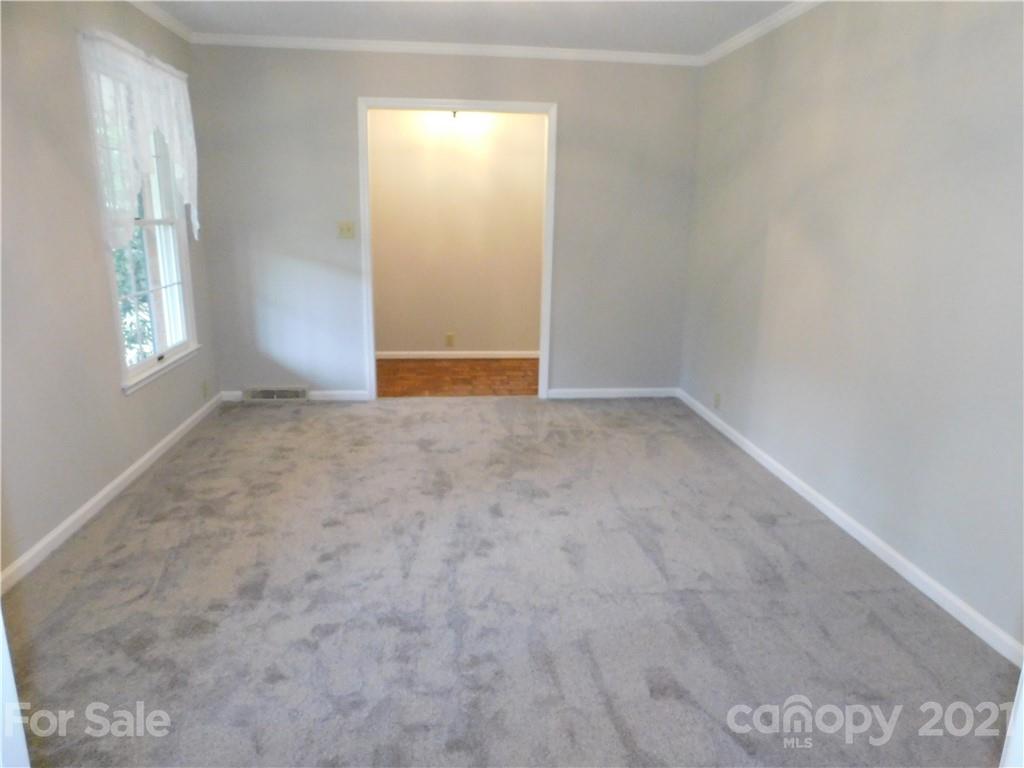 2136 Sunset Road Charlotte, NC 28216 - Photo 13 of 34 an empty room with windows