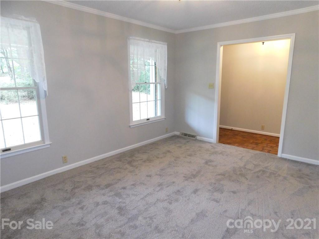 2136 Sunset Road Charlotte, NC 28216 - Photo 14 of 34 an empty room with windows