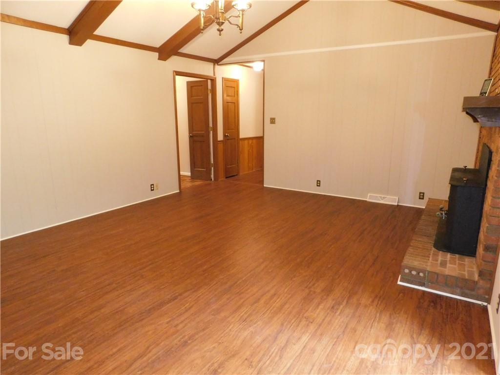 2136 Sunset Road Charlotte, NC 28216 - Photo 19 of 34 a view of a room with wooden floor