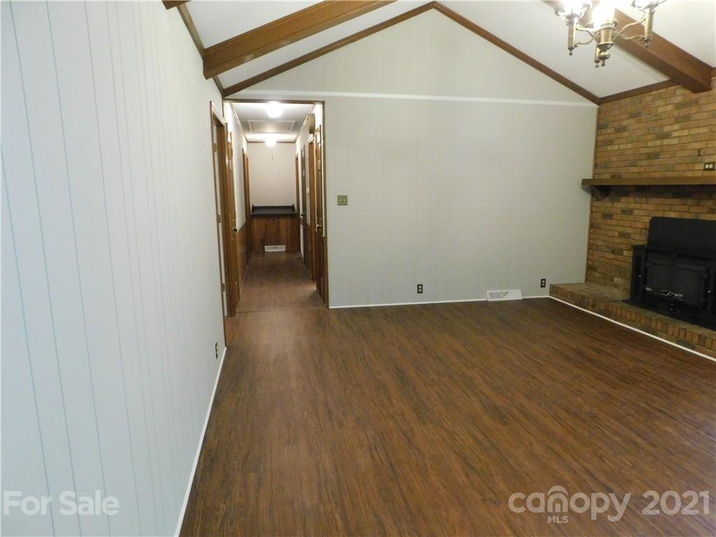 2136 Sunset Road Charlotte, NC 28216 - Photo 21 of 34 a view of a livingroom with wooden floor