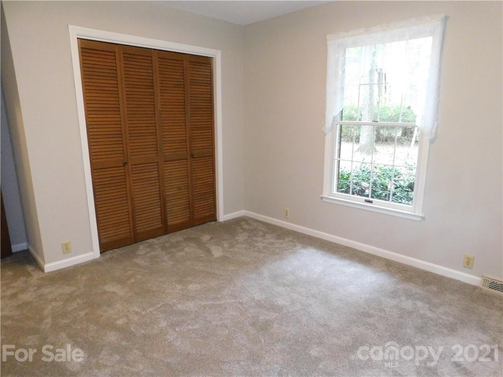 2136 Sunset Road Charlotte, NC 28216 - Photo 30 of 34 an empty room with windows