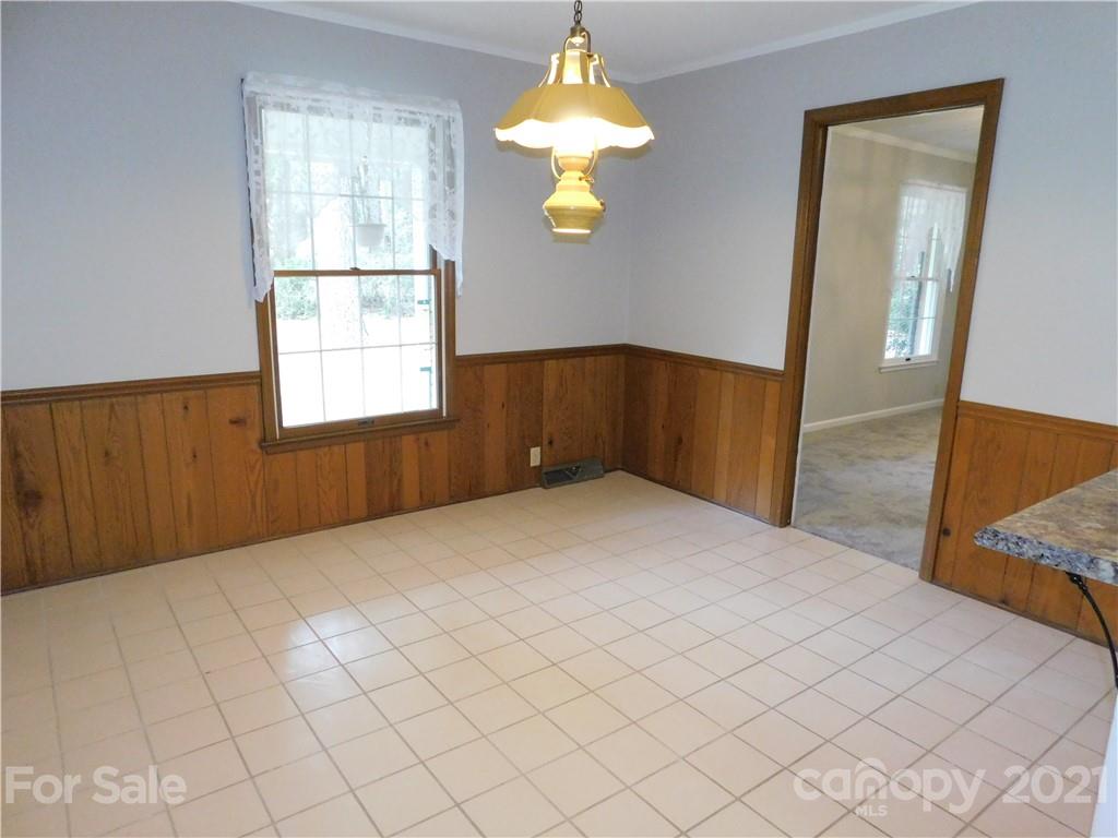 2136 Sunset Road Charlotte, NC 28216 - Photo 10 of 34 a bedroom with bed and window