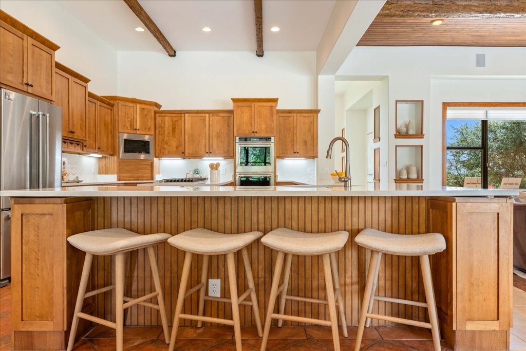 1525 Springlake Drive Dripping Springs, TX 78620 - Photo 10 of 38 a kitchen with a table and chairs
